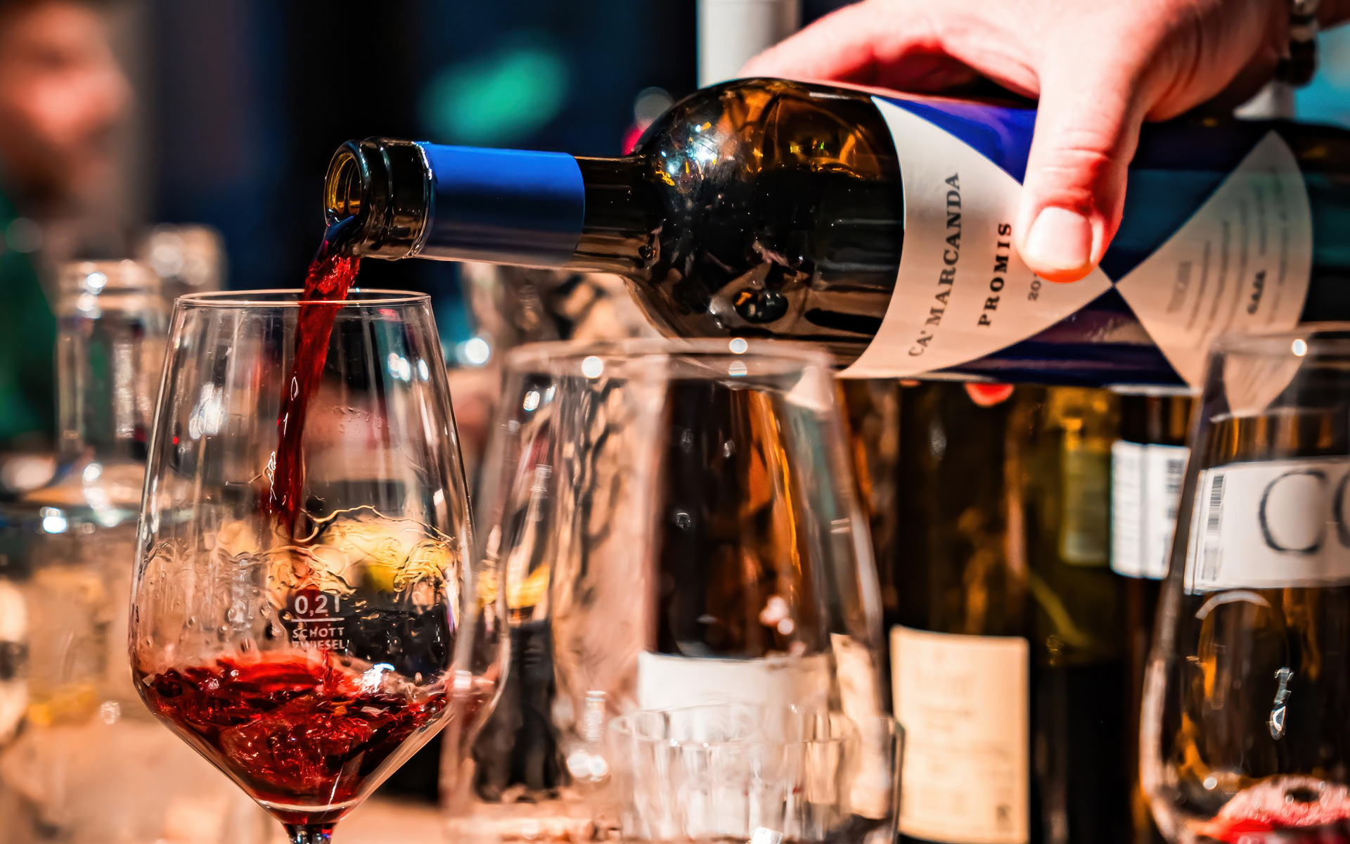 Red wine being poured during a RIWA wine tasting